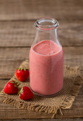 strawberry milk shake on wooden surface