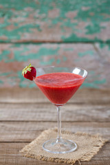 strawberry smoothie on wooden surface