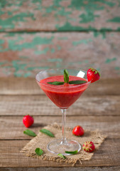 strawberry smoothie on wooden surface
