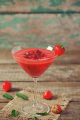 strawberry smoothie on wooden surface