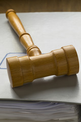Fototapeta premium Gavel on a map with papers