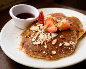 Pancake with strawberries and almond flakes