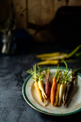 Heirloom carrots in dark background