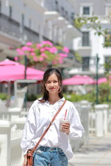 A woman walking on the street in Thanh Hoa, Vietnam