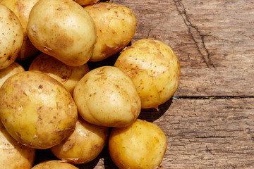 New potatoes on rustic wooden table