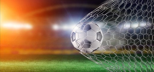 Football ball in the net of a goal - 3d rendering
