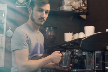 waiter making coffee in the pub