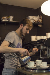 waiter making coffee in the pub