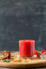 strawberry smoothie on wooden surface