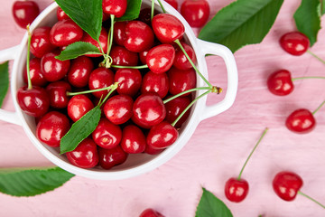 Red cherry in white bowl