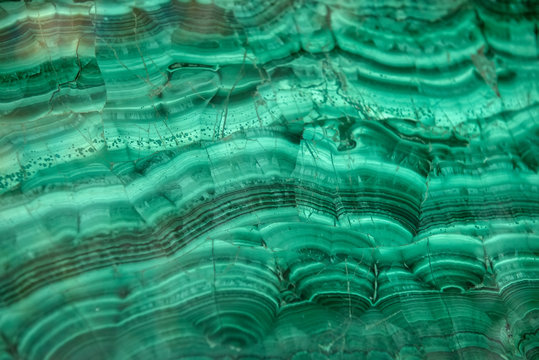 Pattern on polished malachite. Green background