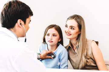 Doctor examining little girl with stethoscope in the hospital.healthcare and medicine
