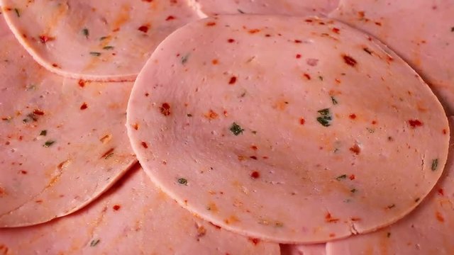 Meat pink pork parizer slices rotating pattern macro texture background backdrop footage video.