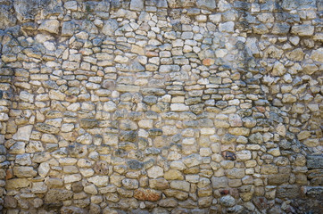 Ancient stone wall, texture. Background from an ancient masonry