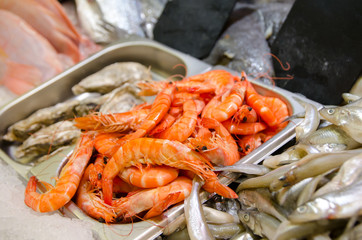 Raw shrimp and fish for sale.