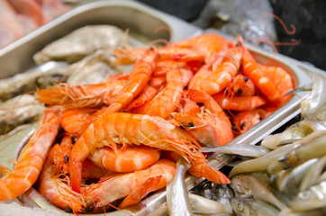 Raw shrimp and fish for sale.