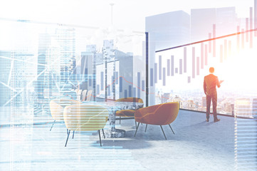 Businessman in conference room, graphs