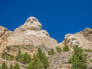 Fototapeta na wymiar Mount Rushmore National Memorial of United States 4th july symbol of America and National Park in South Dakota. Presidents: George Washington, Thomas Jefferson, Theodore Roosevelt, Abraham Lincoln