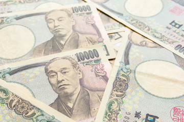 close up image of japanese yen currency banknotes.
