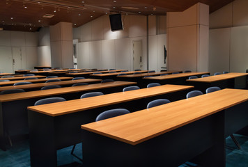 Interior of empty modern conference hall with chairs tables and completely facilities