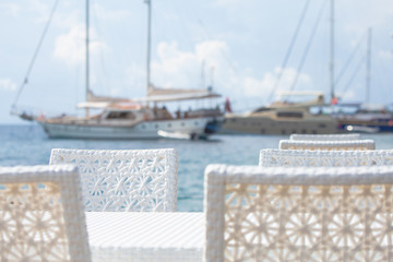 Restaurant on the sea with a view of the yacht