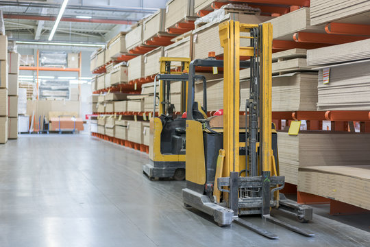 forklift in a construction shop. Construction Materials. Stacking truck in wholesale warehouse