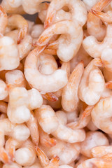 Frozen peeled shrimps. background. Vertical photo