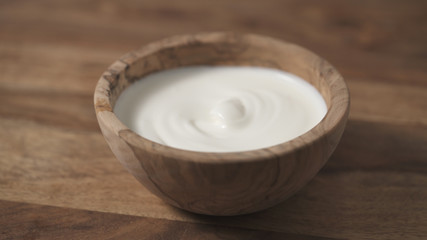 mixing sour cream with spoon