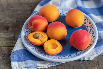 Juicy delicious ripe apricots on a plate.