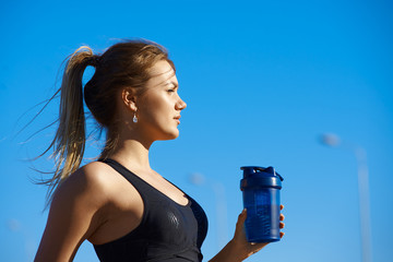 Sports, health, dehydration and activity concept. Outdoor shot of attractive blonde young...