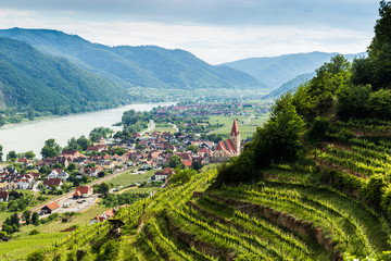 Scenic View into the Wachau with the river Danube and town Weissenkirchen in Lower Austria. - obrazy, fototapety, plakaty