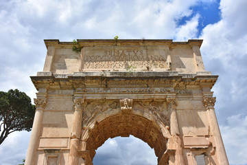 Fototapeta na wymiar Rome, view and details of the archaeological area of the Roman Forums.. Arch of Titus.