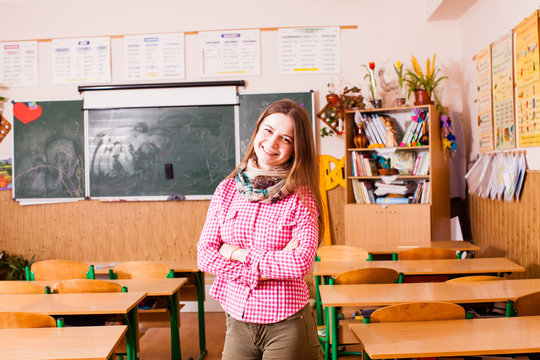 Young smiling woman teacher
