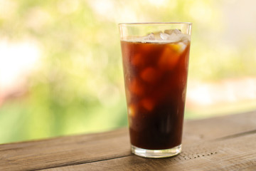 Iced coffee black coffee isolated on green
