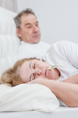 Fototapeta na wymiar old man with sick wife on the bed
