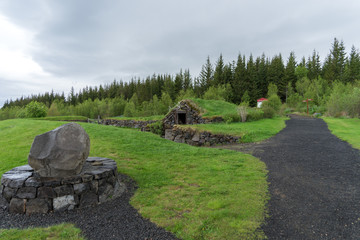Stone hut with grass roof in Reykholt. Iceland