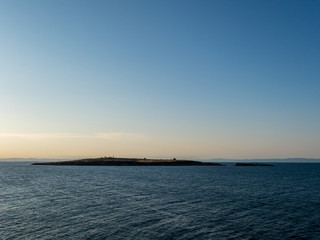 Fototapeta na wymiar Island on sunset