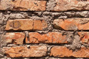 macro of orange brickwork and cement, vintage background, dirty dirty brick wall, texture