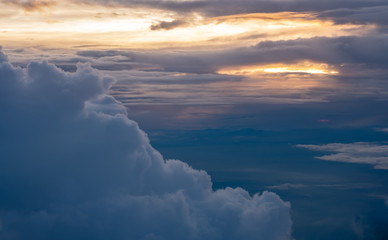 Aerial view of sunset with big cloud at evening sky view on airplane transportation.travel lifestyle.hope concept.