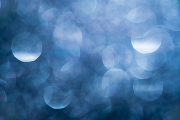 Blurred dark blue bokeh abstract background.use as backdrop for holiday or anniversary occasion celebration.