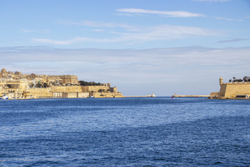 View to the two lighthouses of Grand Harbor, Malta with parts of Valletta and Senglea