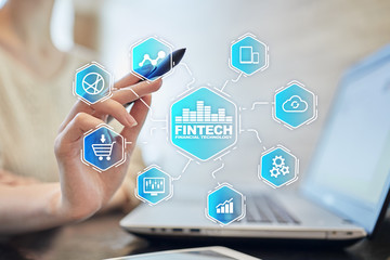Fintech. Financial technology text on virtual screen. Business, internet and technology concept.?