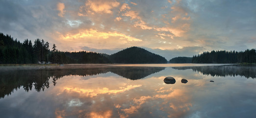 Magic sunrise by the dam lake in Rhodope mountain, Bulgaria. 