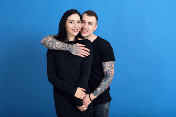 Beautiful couple in love, woman and man with tattoos together.