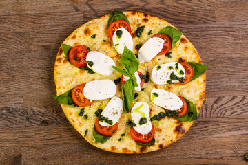 Pizza Caprese with basil