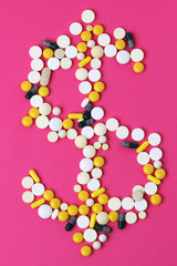 Medicine forming a sign of dollar as a concept of high cost of healthcare