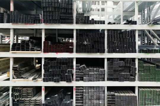 Rectangular metal pipes.Carbon steel tube section.Stainless steel rectangular bars in warehouse of metal products