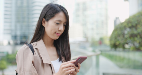 Asian woman use of mobile phone at outdoor