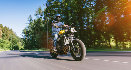 Fototapeta na wymiar motorbike on the road riding. having fun riding the empty road on a motorcycle tour / journey