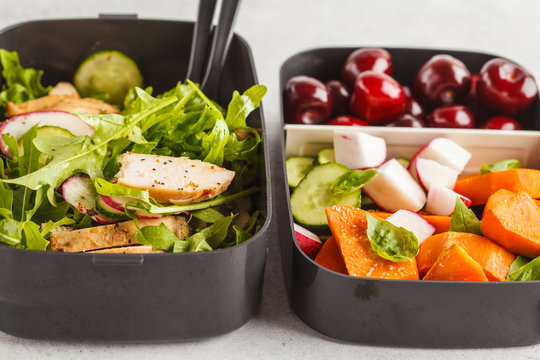 Healthy meal prep containers with grilled chicken with salad, sweet potato, berries, fruits and vegetables, macro.